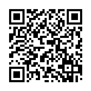 只见李守义将会议桌上的一台电话开启二维码生成